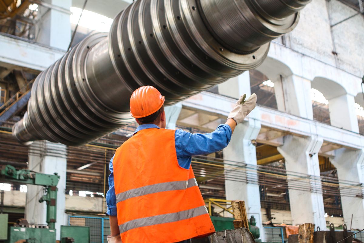Site engineer in hard hat inspecting construction works