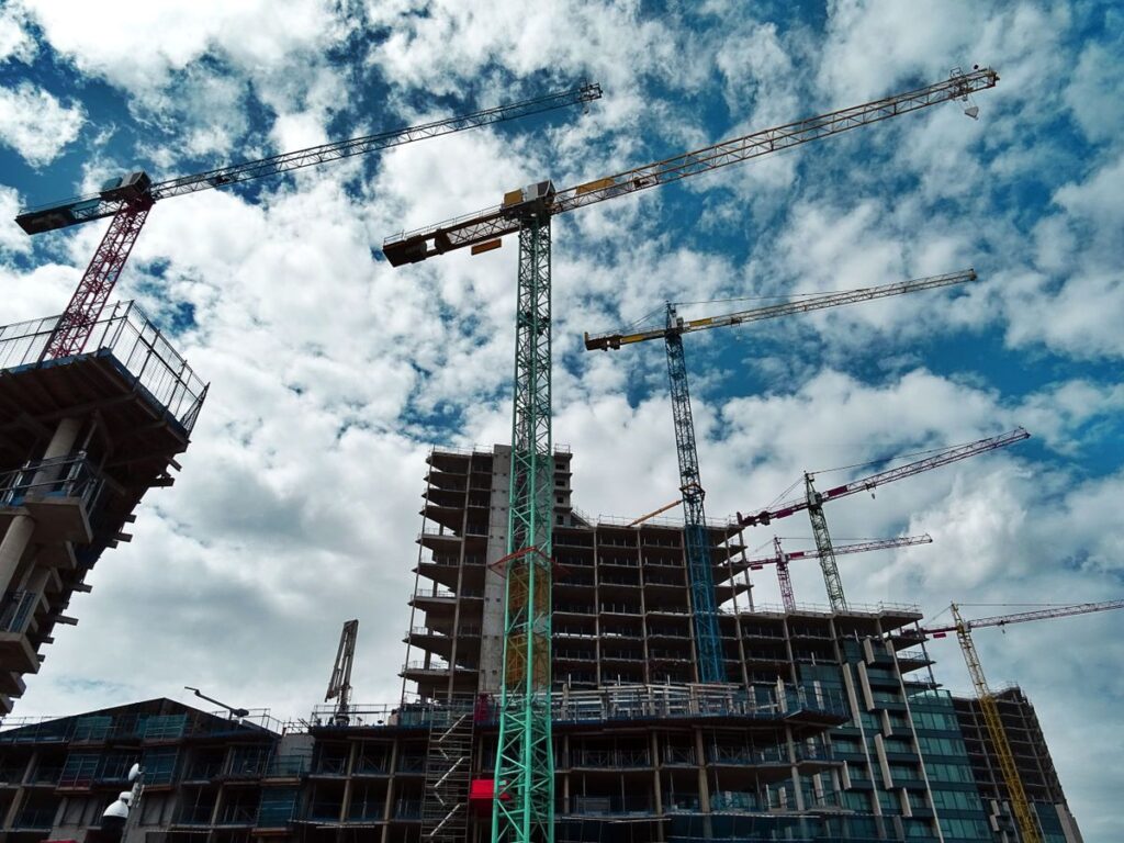 Tower cranes over a building under construction